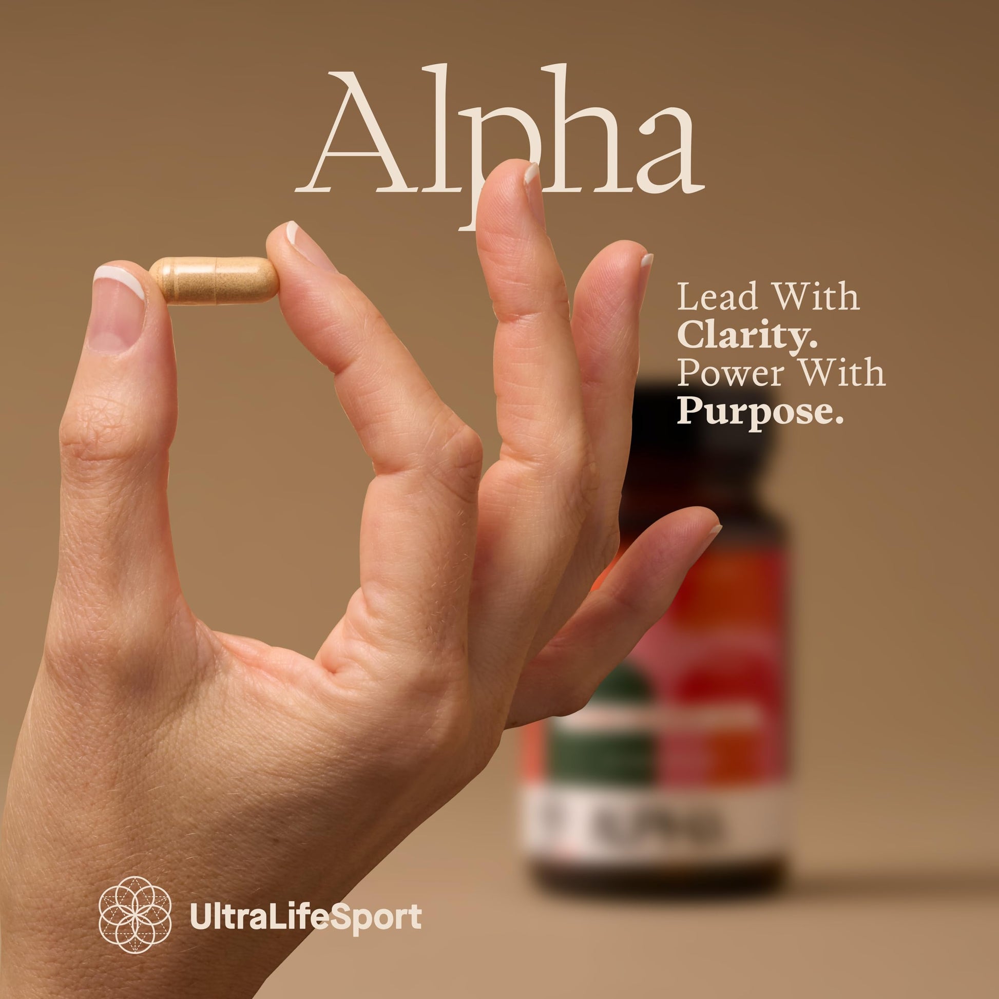 Hand holding a supplement capsule with 'Alpha' branding and UltraLifeSport logo.